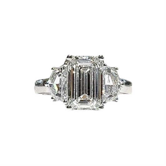 3.03 CT EMERALD CUT THREE STONE RING