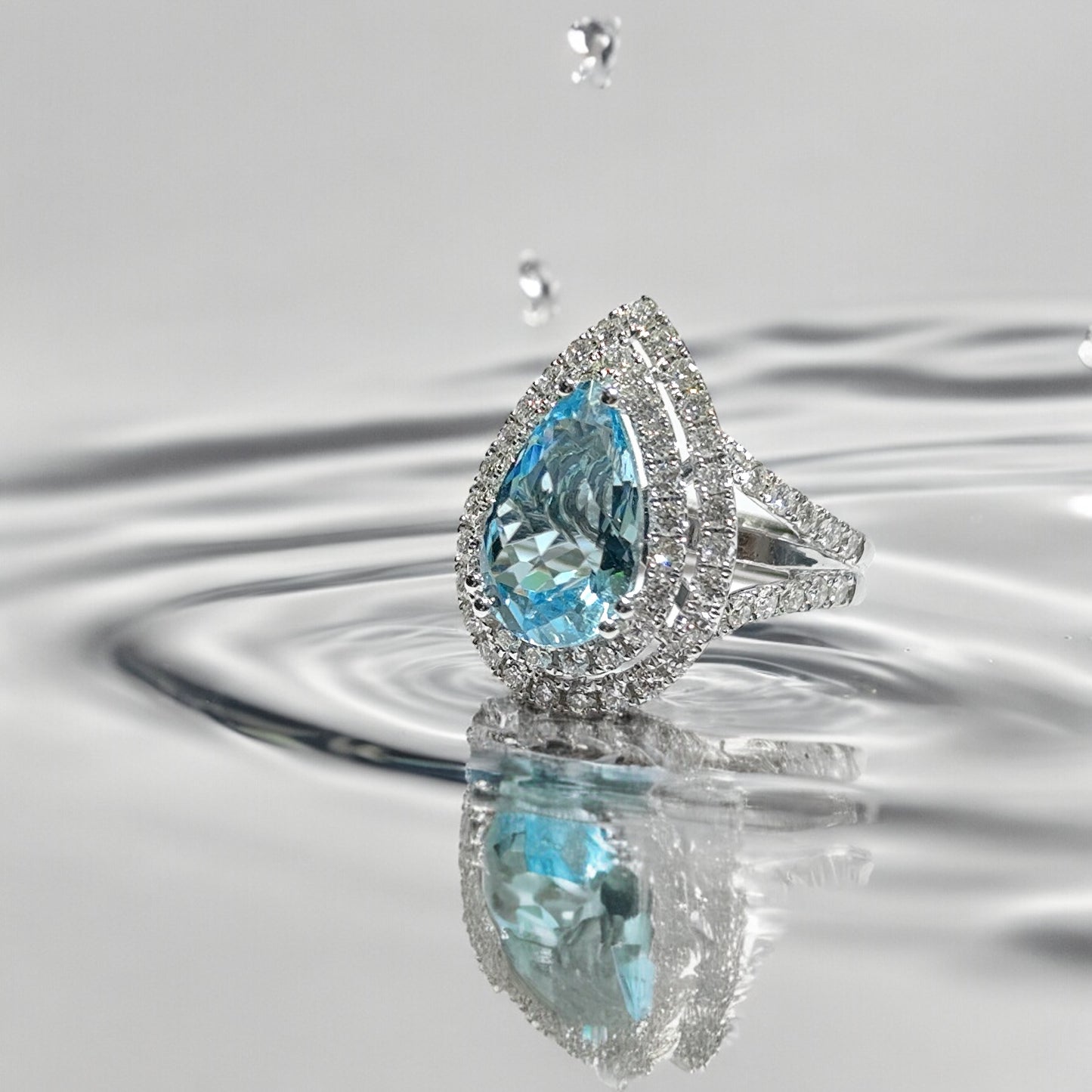 DOUBLE HALO LIGHT BLUE TOPAZ RING