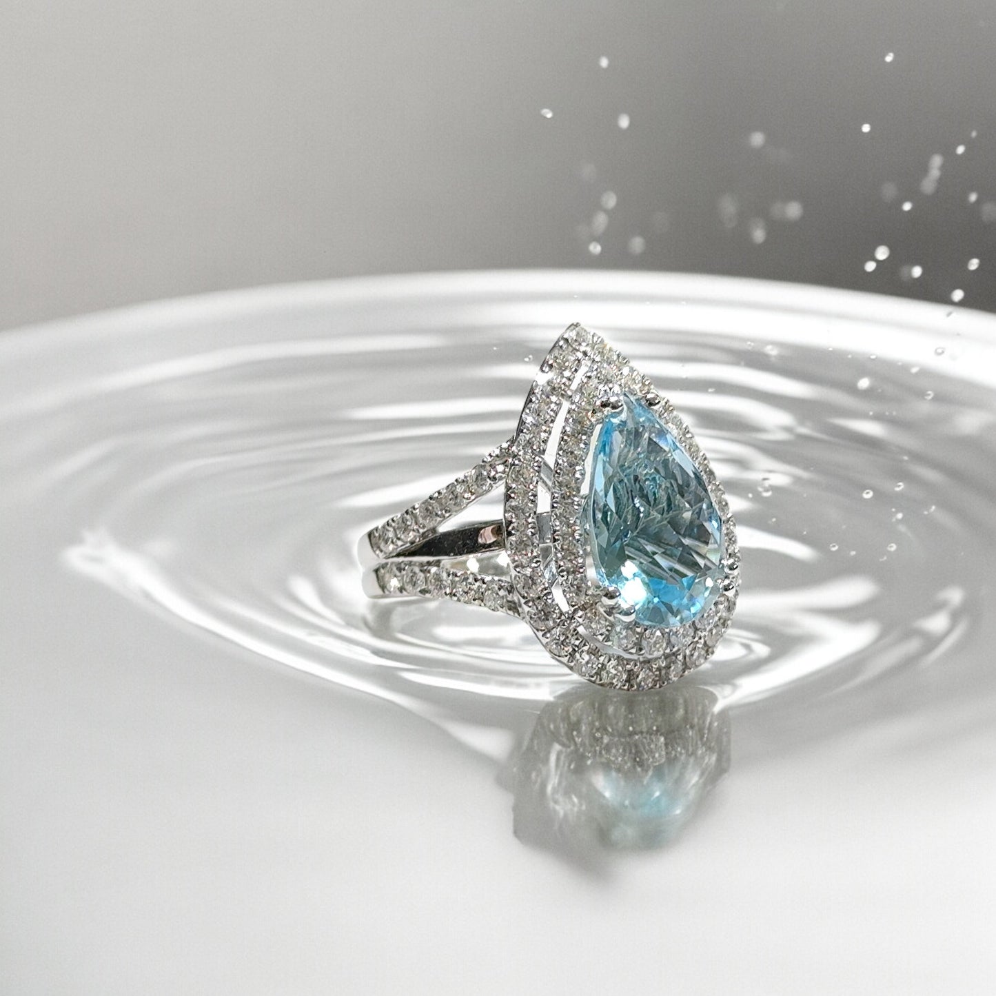 DOUBLE HALO LIGHT BLUE TOPAZ RING